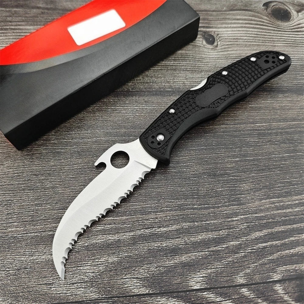 Two Serrated Folding Knives with Hawkbill D2 Blades Durable Textured Nylon Fiber Handles Signature Thumb Hole for Smooth Opening Available in Black and Silver Finishes These Reliable Tools Are Perfect for Everyday Carry Campi