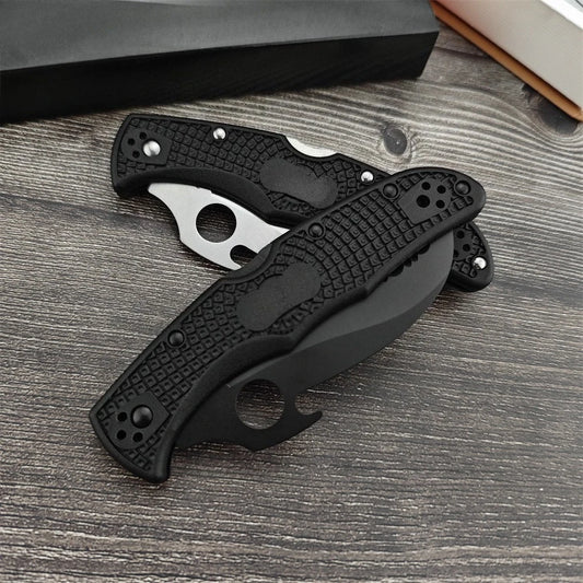Two Serrated Folding Knives with Hawkbill D2 Blades Durable Textured Nylon Fiber Handles Signature Thumb Hole for Smooth Opening Available in Black and Silver Finishes These Reliable Tools Are Perfect for Everyday Carry Campi