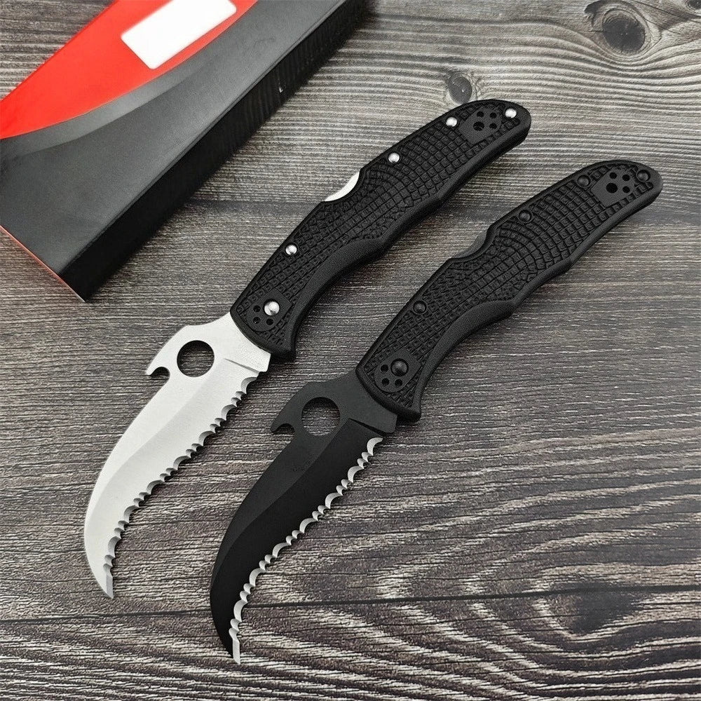 Two Serrated Folding Knives with Hawkbill D2 Blades Durable Textured Nylon Fiber Handles Signature Thumb Hole for Smooth Opening Available in Black and Silver Finishes These Reliable Tools Are Perfect for Everyday Carry Campi