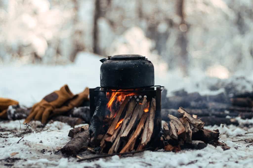 outdoor stove with campfire winter coffee pot